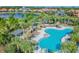 Community pool with lounge chairs and shaded areas at 13204 Waterleaf Garden Cir, Riverview, FL 33579