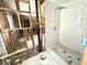 Bathroom with a new shower and marble tile. Currently under construction at 1818 Michigan Ne Ave, St Petersburg, FL 33703