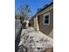 Side yard with gravel and a white vinyl fence at 1818 Michigan Ne Ave, St Petersburg, FL 33703