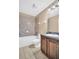 A full bathroom is shown with a tub and shower combination, toilet, and sink with vanity at 4539 Legacy Park Dr, Tampa, FL 33611