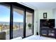 Balcony view showcasing ocean views, a sliding glass door and a comfortable seating area at 2618 Gulf Blvd # 407, Indian Rocks Beach, FL 33785