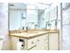 Bathroom featuring double sinks with granite countertops, and a tiled backsplash at 2618 Gulf Blvd # 407, Indian Rocks Beach, FL 33785