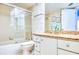 Bathroom featuring a shower over tub and vanity with granite countertop at 2618 Gulf Blvd # 407, Indian Rocks Beach, FL 33785