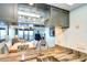 Modern kitchen featuring granite countertops, stainless steel sink and fixtures, and gray cabinets at 2618 Gulf Blvd # 407, Indian Rocks Beach, FL 33785