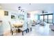 Spacious living and dining area with contemporary decor, tile floors, ocean views and ample natural light at 2618 Gulf Blvd # 407, Indian Rocks Beach, FL 33785
