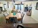 Open-concept living room with dining area, fireplace, tile flooring, balcony access and breathtaking ocean views at 2618 Gulf Blvd # 407, Indian Rocks Beach, FL 33785