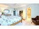 Main bedroom with tile flooring, ceiling fan, and an en suite bathroom at 2618 Gulf Blvd # 407, Indian Rocks Beach, FL 33785