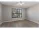 Spacious bedroom with large window and hardwood floors at 1662 Seascape Cir # 205, Tarpon Springs, FL 34689