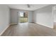 Well-lit secondary bedroom with hardwood flooring at 1662 Seascape Cir # 205, Tarpon Springs, FL 34689