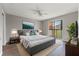 Spacious primary bedroom with private balcony access at 1662 Seascape Cir # 205, Tarpon Springs, FL 34689