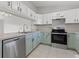 Modern kitchen featuring updated cabinetry and appliances at 1662 Seascape Cir # 205, Tarpon Springs, FL 34689