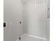 Small laundry room with hookups and tile floor at 1662 Seascape Cir # 205, Tarpon Springs, FL 34689