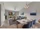 Bright living room with hardwood floors and access to balcony at 1662 Seascape Cir # 205, Tarpon Springs, FL 34689