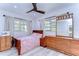 Cozy bedroom featuring a double bed and ample wood furniture at 1802 E Hamilton Ave, Tampa, FL 33610