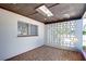 Covered patio with tiled floor and block wall at 1802 E Hamilton Ave, Tampa, FL 33610
