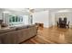 Bright dining room with hardwood floors and a view to the living room at 5544 Legend Hills Ln, Spring Hill, FL 34609