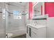 Bathroom features white subway tiles, glass shower doors, and updated vanity at 2210 4Th N Ave, St Petersburg, FL 33713