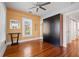 Bedroom with wood floors, modern closet, ceiling fan, and bright windows at 2210 4Th N Ave, St Petersburg, FL 33713