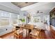 Open concept dining area with wood floors and access to the kitchen and living room at 2210 4Th N Ave, St Petersburg, FL 33713