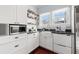 Bright kitchen with stainless steel appliances, farmhouse sink, granite countertops and wood floors at 2210 4Th N Ave, St Petersburg, FL 33713