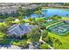 Aerial view of community pool, tennis courts, and clubhouse at 7296 Marathon Dr # 603, Seminole, FL 33777