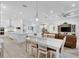 Bright dining room with white table and chairs near the kitchen at 824 Manns Harbor Dr, Apollo Beach, FL 33572