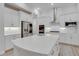 Bright kitchen with white cabinets, quartz countertops, and stainless steel appliances at 824 Manns Harbor Dr, Apollo Beach, FL 33572