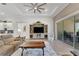 Bright living room showcasing a stylish entertainment center and comfortable sofas at 824 Manns Harbor Dr, Apollo Beach, FL 33572