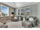 Relaxing sitting area off the main bedroom, featuring comfortable armchairs and a fireplace at 824 Manns Harbor Dr, Apollo Beach, FL 33572