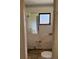 Small bathroom needing renovation. Features a toilet and sink at 64 Inness Dr, Tarpon Springs, FL 34689