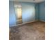 Empty bedroom with light blue walls and mirrored closet at 64 Inness Dr, Tarpon Springs, FL 34689