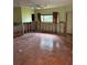 Large bedroom with tile floors ready for renovation at 64 Inness Dr, Tarpon Springs, FL 34689