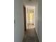 Long hallway with light colored walls and flooring at 64 Inness Dr, Tarpon Springs, FL 34689