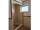 Shower with brown tiled walls at 64 Inness Dr, Tarpon Springs, FL 34689