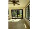 Sunroom with sliding glass doors and ceiling fan at 64 Inness Dr, Tarpon Springs, FL 34689