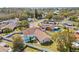 Aerial view showing house, pool, and neighborhood at 1300 Cedar Ct, Tarpon Springs, FL 34689