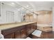 Large bathroom with double vanity, soaking tub, and separate shower at 1300 Cedar Ct, Tarpon Springs, FL 34689