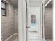 Bathroom with shower, tub, and pool access at 1300 Cedar Ct, Tarpon Springs, FL 34689
