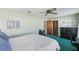 Spacious bedroom with a queen bed and ample closet space at 1300 Cedar Ct, Tarpon Springs, FL 34689