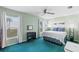 Bright bedroom with a queen-size bed and a workspace at 1300 Cedar Ct, Tarpon Springs, FL 34689