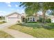 House exterior with well maintained lawn at 1300 Cedar Ct, Tarpon Springs, FL 34689