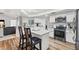 Modern kitchen with white cabinets, granite counters, and island at 1300 Cedar Ct, Tarpon Springs, FL 34689