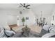 Open living room and dining area with gray sofas and a coffee table at 1300 Cedar Ct, Tarpon Springs, FL 34689
