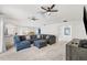 Spacious living area featuring a sectional sofa and access to other rooms at 1300 Cedar Ct, Tarpon Springs, FL 34689
