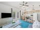 Living room with kitchen and pool access at 1300 Cedar Ct, Tarpon Springs, FL 34689