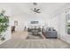 Spacious living room with gray sofas, coffee table and carpeting at 1300 Cedar Ct, Tarpon Springs, FL 34689