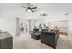 Bright living room with comfy sectional sofa and access to backyard patio at 1300 Cedar Ct, Tarpon Springs, FL 34689