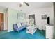 Living room with sofa, TV, and soft carpet at 1300 Cedar Ct, Tarpon Springs, FL 34689