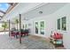 Covered patio with dining set and pool view at 1300 Cedar Ct, Tarpon Springs, FL 34689