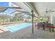 Relaxing pool area with patio furniture at 1300 Cedar Ct, Tarpon Springs, FL 34689